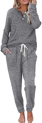 A relaxed dark grey two-piece set cut from soft knit with a buttoned V-neck top and pocketed drawstring pants.