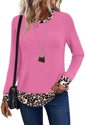 Soft rose knit meets a bold leopard print hem in a relaxed crewneck cut that pairs easily with dark denim or leggings.