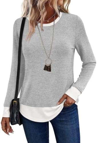 Pale heather grey meets crisp white along the hem on a breezy knit tuned for cooler morning air and breezy evenings.