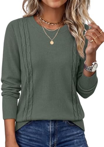 A rich green tunic sweater in a breathable fine knit, cut with ribbed trims and extra length to wear over leggings.