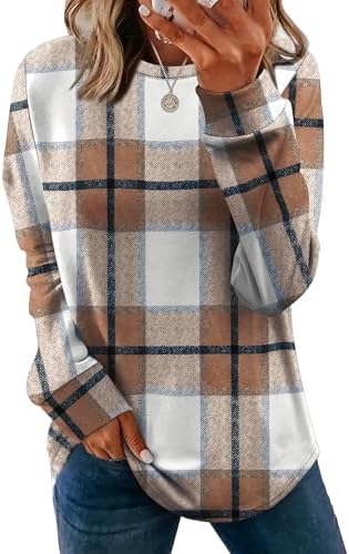 A relaxed crewneck tunic in warm caramel plaid, cut with a curved hem and subtle side slits for extra coverage.