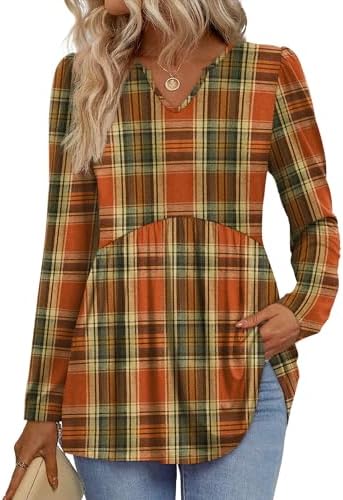 Warm caramel tones and crisp plaid lines define this roomy babydoll tunic, finished with gathered puff sleeves and an open v-neck.