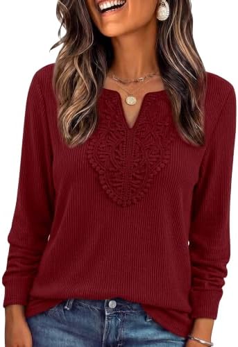 Bright red ribbed knit meets delicate lace trimming along the neckline on this cozy, relaxed long-sleeve top.