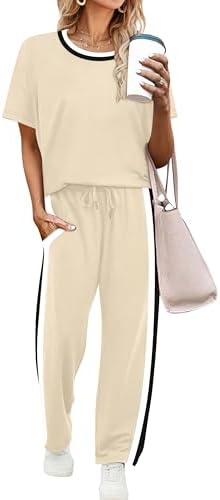 Light spacer knit in soft cream pairs a short sleeve top with cropped wide leg pants for warm travel days.