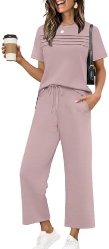 Cut in a cheerful pink spacer knit, this two-piece set pairs a side-slit top with breezy wide-leg cropped bottoms.