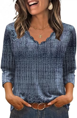 Scalloped edges trace the neckline of this deep navy boho print blouse, cut with easy three-quarter sleeves for warm days.