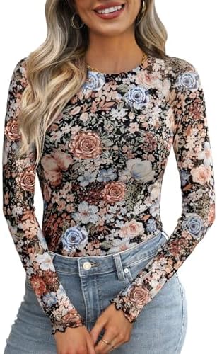Delicate floral embroidery floats across sheer mesh in this airy long-sleeve layer cut with plenty of stretch.