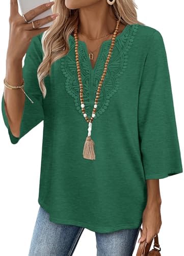 A soft three-quarter sleeve tunic in rich light dark green, finished with delicate front lace and a curved hem.