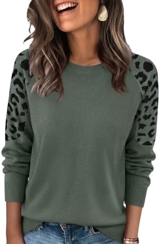 A muted grey green body joins leopard jacquard raglan sleeves for an easy layer when summer evenings turn cool.