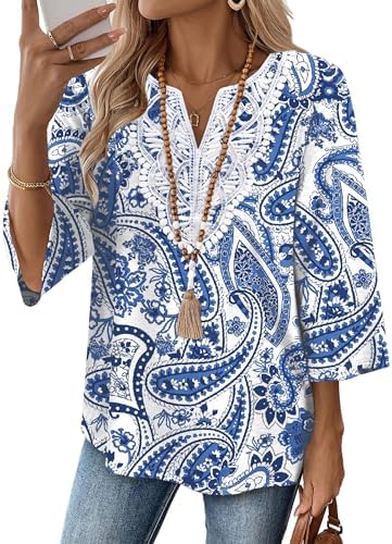 Crisp blue botanicals and tribal motifs spread across a bright white base on this lightweight three-quarter sleeve tunic.