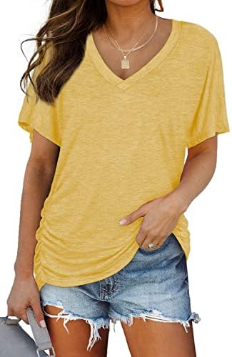 Bright yellow rayon-blend knit brings sunny contrast to dark denim, cut with a relaxed dolman sleeve and gentle side ruching.