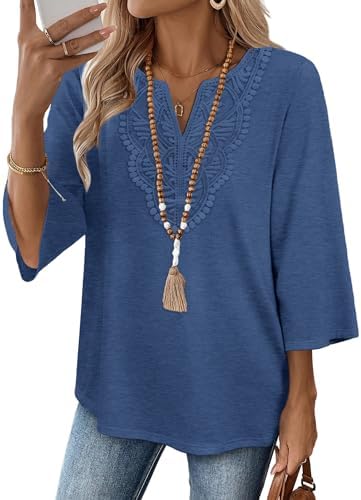 Delicate front lace detailing meets a rich deep blue knit on this three-quarter sleeve tunic cut with a relaxed curved hem.