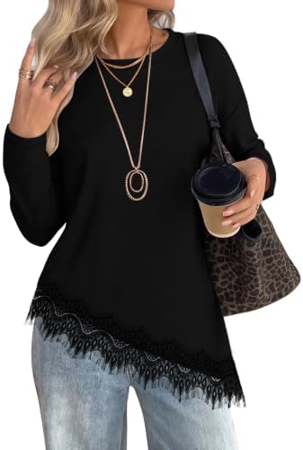 Delicate lace trims the curved asymmetrical hem of this jet black long sleeve knit, adding texture to a classic crewneck tunic.