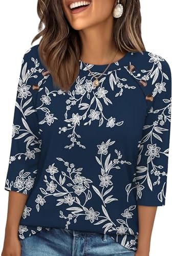 Small flowers scattered across a deep navy ground give this loose three-quarter sleeve top an easy, put-together feel.