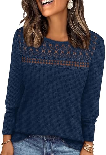 Crochet lace across the chest meets soft navy waffle knit in a long sleeve top cut easy through the body.