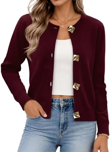 A deep burgundy knit topped with bright metal buttons gives this light layer rich contrast against faded denim and white tees.