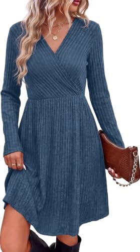 A crisp blue ribbed knit shapes this long sleeve dress, cut with a crossover neckline, practical side pockets, and an A-line hem.