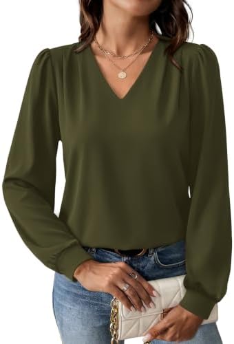 A crisp green knit blouse cut with subtle shoulder pleats and gathered cuffs, tailored for classroom days and office hours.