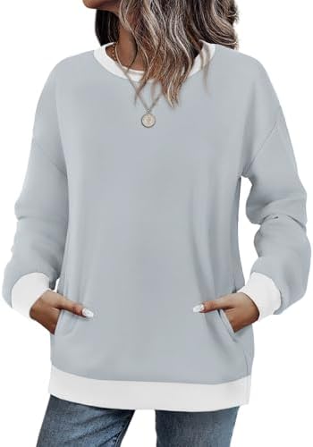 Heathered grey white knit shapes this light crewneck sweatshirt, cut with dropped shoulders and a tucked-away side pocket.
