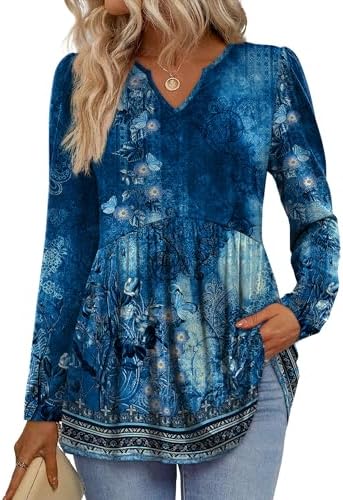 A breezy babydoll blouse in deep floral blue, cut loose through the body with gathered long puff sleeves and a neat V neckline.