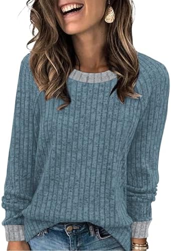 A soft blue colorblock sweater cut with a relaxed body and full sleeves for breezy mornings and cool evenings.
