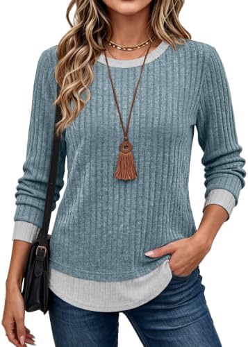 A soft blue knit top with a built-in layered collar and hem detail gives you a clean two-in-one look without extra bulk.