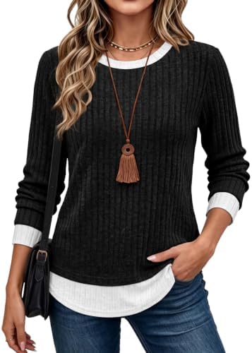 Crisp white contrast trims peek out at the crewneck and hem of this jet black long sleeve knit top.
