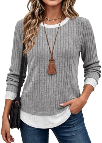 A soft gray knit with built-in contrast layering gives you the look of two tops without any extra bulk or bunching.