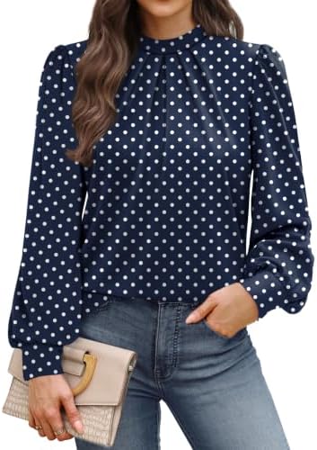 Crisp white dots on deep navy ground this lightweight mock neck blouse, cut with subtle puff sleeves and front pleating.