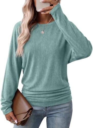Soft sage green knit pairs with dolman sleeves and side shirring to give this easy crew neck tunic a relaxed drape.