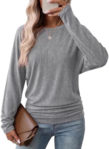 A soft heather grey tunic cut with generous dolman sleeves and side ruching at the hips for cool days.