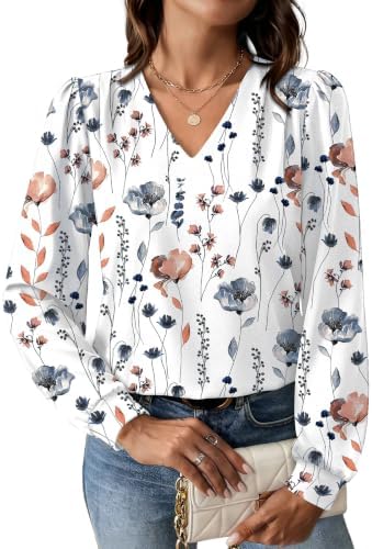 Crisp botanical blooms scatter across an airy, stretchy base with gentle shoulder pleats and gathered cuffs for full workdays.