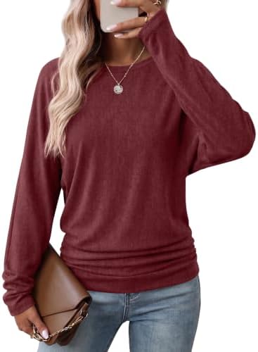 A deep wine red knit pullover with generous dolman sleeves and side-shirred hem detailing for easy layering.