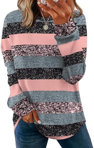 Horizontal stripes in soft pink brighten this loose crewneck tunic, cut long through the torso with subtle side slits for easy movement.