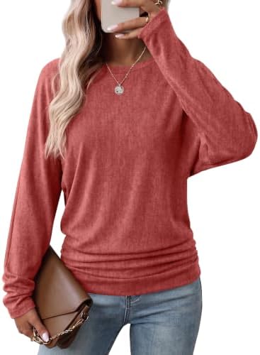 Cut with a generous batwing sleeve and ruched hip, this vivid red tunic knit brings rich color to crisp fall mornings.