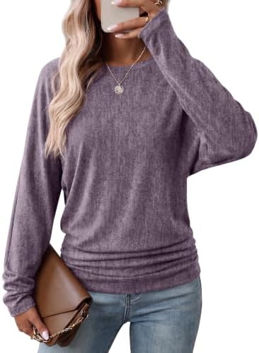 Rich purple knit sets a cheerful tone on this batwing pullover, shaped with side gathers along the lower hem.