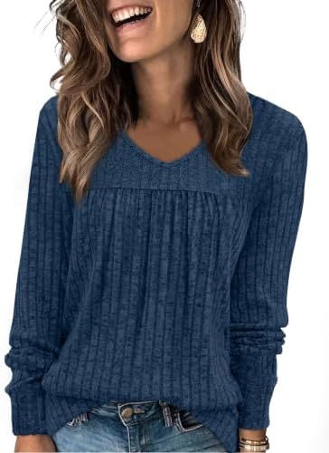 A soft blue ribbed knit top with a neat V-neckline and front pleats, cut with long sleeves for cool morning walks and travel days.