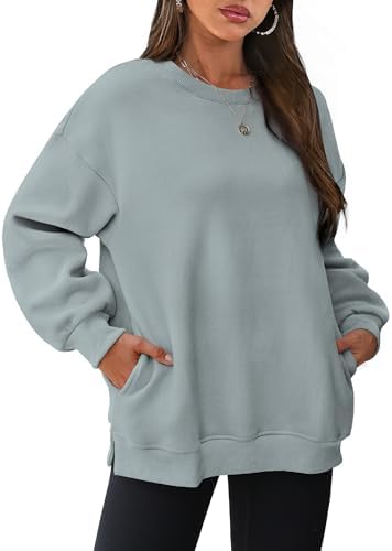A soft cotton-blend fleece pullover cut roomy with side slits and hidden pockets for breezy summer nights and crisp fall days.