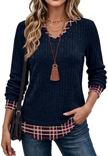 A built-in plaid hem peeks out beneath deep navy ribbed knit, giving this lightweight tunic an easy two-piece look.