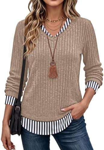 Warm mocha tones meet crisp vertical stripes on this faux-layered tunic top, cut loose through the body for easy movement.