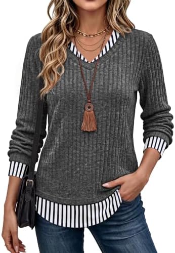Fine grey striping gives this faux-layered tunic clean visual depth without adding the bulk of two separate knit tops.
