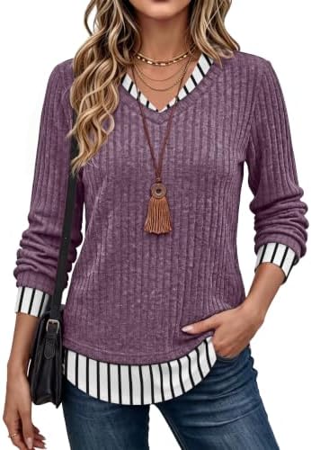 A ribbed purple knit meets a striped contrast panel for a neat layered look in one lightweight long sleeve tunic.