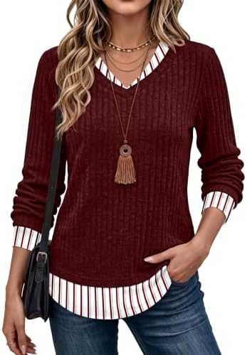 Deep wine tones meet a crisp striped underlay in this two-in-one long sleeve tunic sweater with a neat V-neckline.