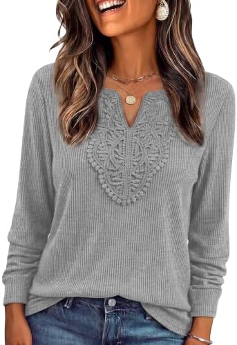 Delicate lace borders the open V-neck on this soft ribbed knit top, finished with a relaxed tunic hem for cool-weather ease.