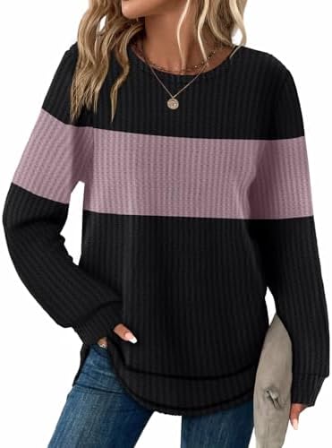 Deep black meets soft lotus purple in this waffle knit tunic cut with a curved hem and easy long sleeves for cool days.