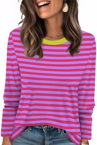 Vibrant hot pink stripes bring sharp color contrast to a soft crewneck tunic cut for easy layering on cool days.