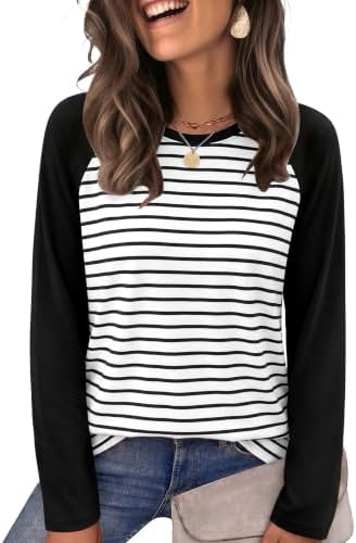 Crisp black and white stripes give this soft crewneck top a sharp contrast that pairs cleanly with dark denim or tailored skirts.