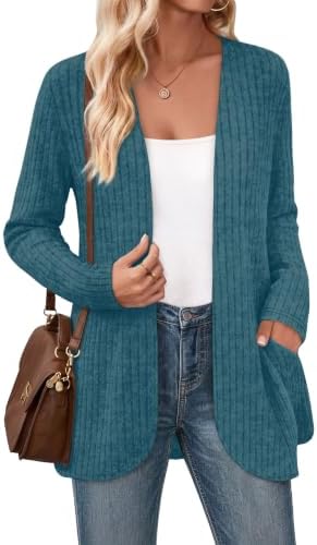 A deep marine blue cardigan with an easy open front, subtle brushed texture, and roomy side pockets cut for relaxed layering.