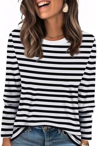 Crisp black and white stripes bring graphic contrast to a soft long sleeve tunic cut for easy pairing with denim or leggings.