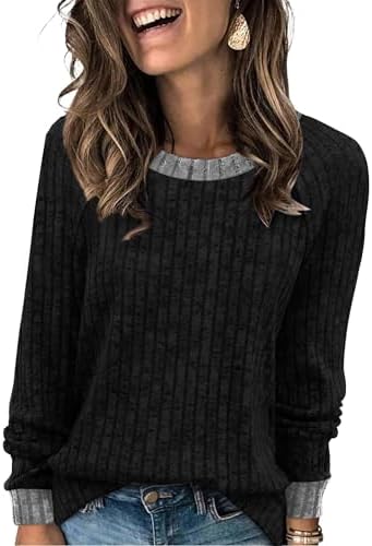 A solid black long-sleeve knit brings blanket-soft texture and a relaxed shape to cool mornings and breezy evening strolls.